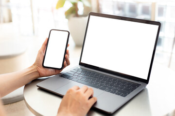 computer screen,cell phone blank mockup.hand woman work using laptop texting mobile. with white background for advertising,contact business search information on desk in cafe.marketing,design