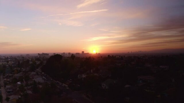 Wide aerial shot of the city of Los Angeles during sunset. 4K