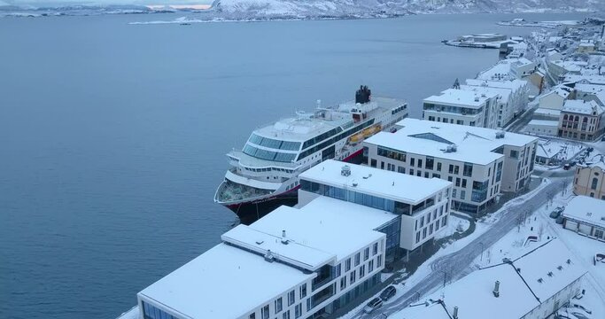 Beautiful, drone footage that shows Alesund, the most beautiful town in Norway, the surrounding islands and the port in winter time when everything is covered in thick layer of snow.