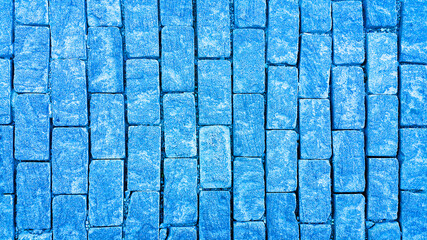 Sidewalk. Rectangular cobblestones. Construction industry. Stone background. Copy space for text.