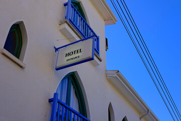 signboard with the inscription hotel on the building