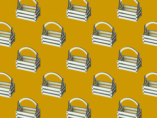 Seamless pattern of wooden boxes on a yellow background.