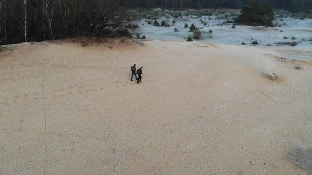 People walking on cold desser in the Netherlands
