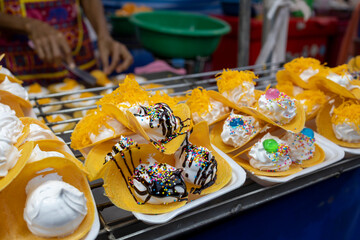 Delicious Thai dessert, kanom buang, crispy pancake with egg white filling