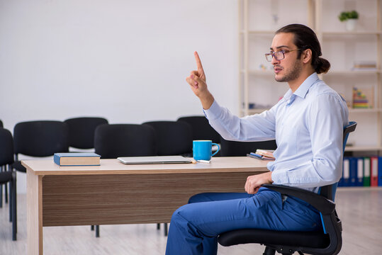 Young male boss giving seminar in the office during pandemic - Powered by Adobe