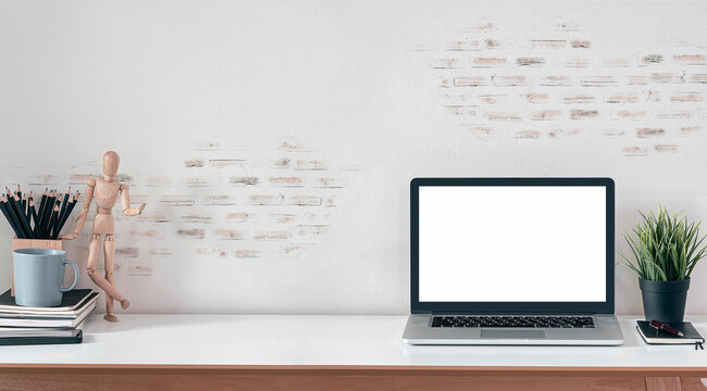 Mockup workspace with blank screen laptop computer.