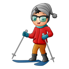 Cute little boy skiing in winter clothes