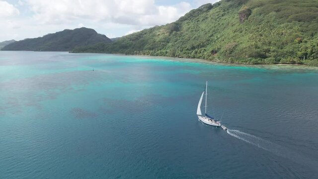 4K Aerial video of sail boat in clear blue water french polynesia island
