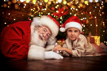 Obraz premium jolly Santa with a child
