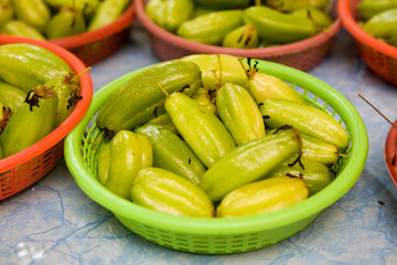 Thai cucumbers in plastic basket