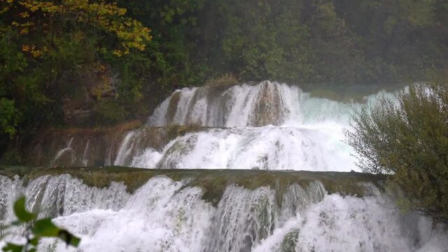 Closer up view of a series of waterfalls with blowing mist at Krka National Park in Croatia at &frac14; speed