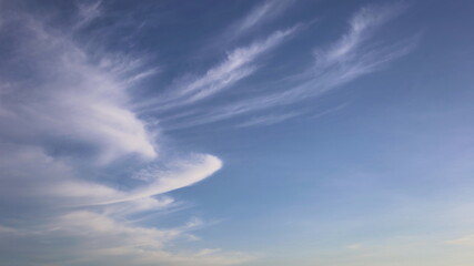 Beautiful white clouds in the blue sky. Interesting shape or pattern of natural white clouds in...
