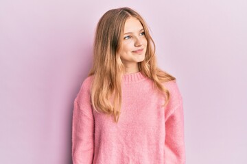 Fototapeta premium Beautiful young caucasian girl wearing casual clothes smiling looking to the side and staring away thinking.