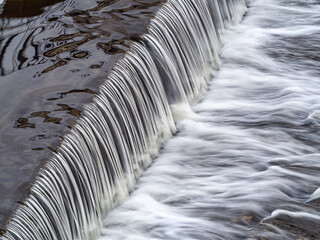 A small flat cascade in a calm river