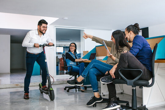 Latin Business People Having Fun In Creative Office Happy Hour In Mexico City