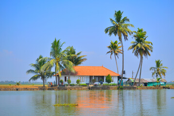 Fototapeta premium A house on the edge of a lake in Kerala backwaters near alleppey