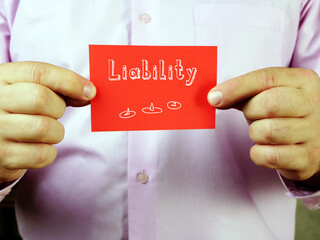 Business concept meaning  Liability    with phrase on the piece of paper.
