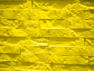 Background from a yellow brick wall. presentation of fashion colors 2021