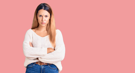 Beautiful young woman wearing casual clothes skeptic and nervous, disapproving expression on face...