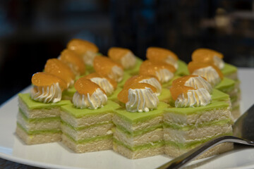 Matcha green tea cake slices on a buffet