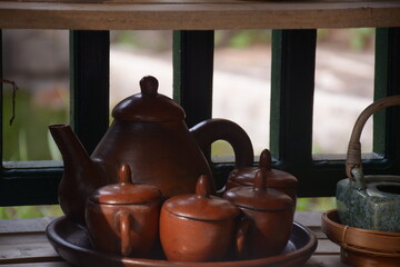 unique kettle and cup with blur background