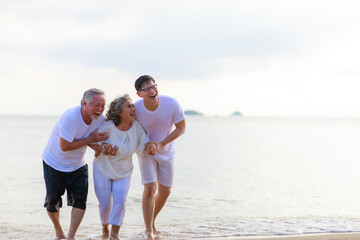 Happy family walking relax on the beach.