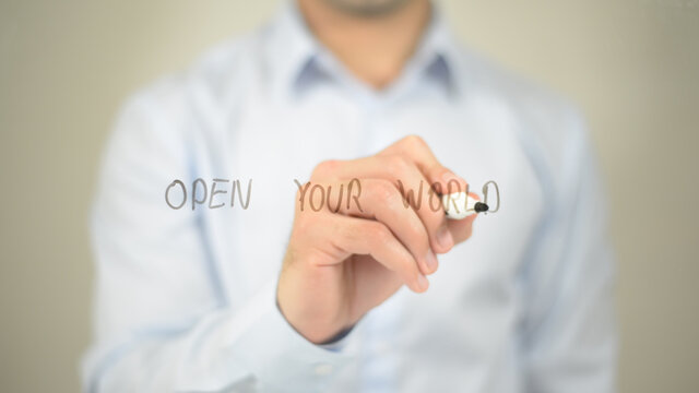 Open Your World , man writing on transparent screen