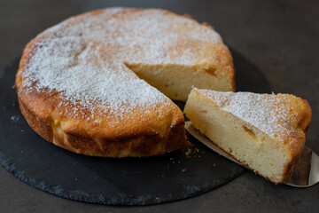 typical German Cheesecake on a plate on a table