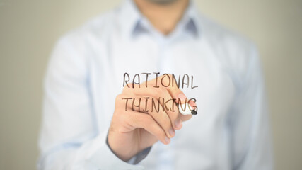 Rational Thinking , man writing on transparent screen