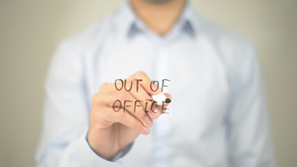 Out Of Office, man writing on transparent screen