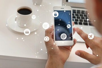 Young man using mobile phone at home. Concept of internet