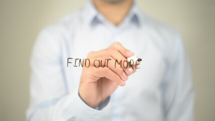 Find Out More , man writing on transparent screen