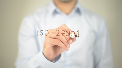 ISO 27001 , man writing on transparent screen