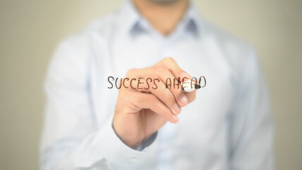 Success Ahead  , man writing on transparent screen