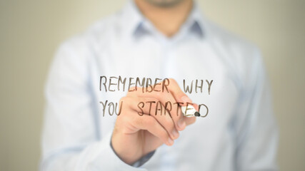 Remember Why You Started , man writing on transparent screen