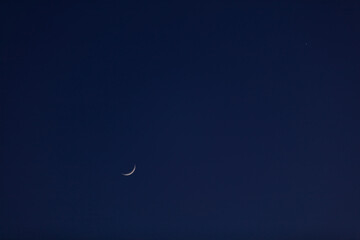 Astronomical conjunction of Venus and Moon, photographed with long focal lens.