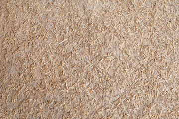 Old rice hulls (rice husks). The hard protecting coverings of grains of rice.