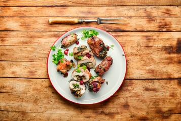 Stuffed meat rolls on a plate.