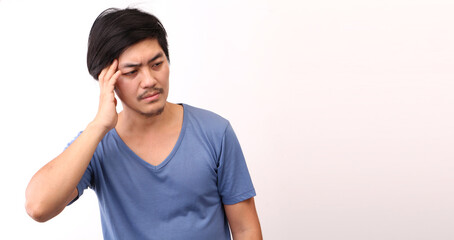 Fototapeta premium Portrait of a handsome,Asian man with a headache on White background in studio With copy space.