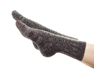 Wool socks on the foot. Close up. Isolated on a white background