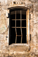 old empty barred window in the house