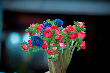 Colorful bouquets are held in hand
