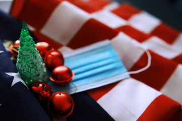 Merry Christmas and Happy New Year. Beautiful card with American flag. Beautiful christmas background with medical Mask.