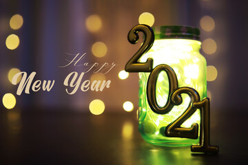 Holiday led light garland in jar with number 2021. Christmas, new year holiday celebration concept. Copy space.