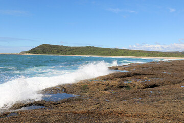 Waves Crashing Over Rocks at Catherine Hill Bay, Moonee Beach New South Wales, Australia