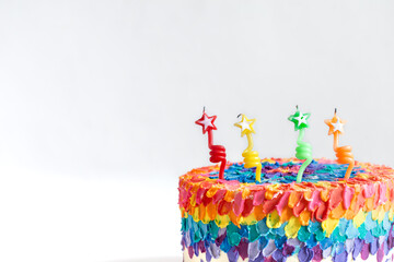 Fototapeta premium Handmade colorful big birthday cake with four candles.