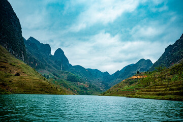 Fototapeta na wymiar Ma Pi Leng Mountain view from Nho Que River, one of the most beautiful is a River in Vietnam