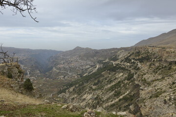 Fototapeta premium Aerial shot of the valley and village. Lebanese village. Calm before the storm. Fall season