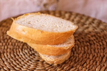 Cut pieces of baguette lie on top of each other.
