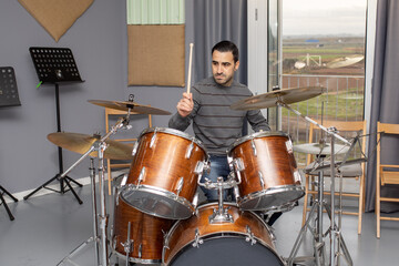 man playing musical instrument percussion drums